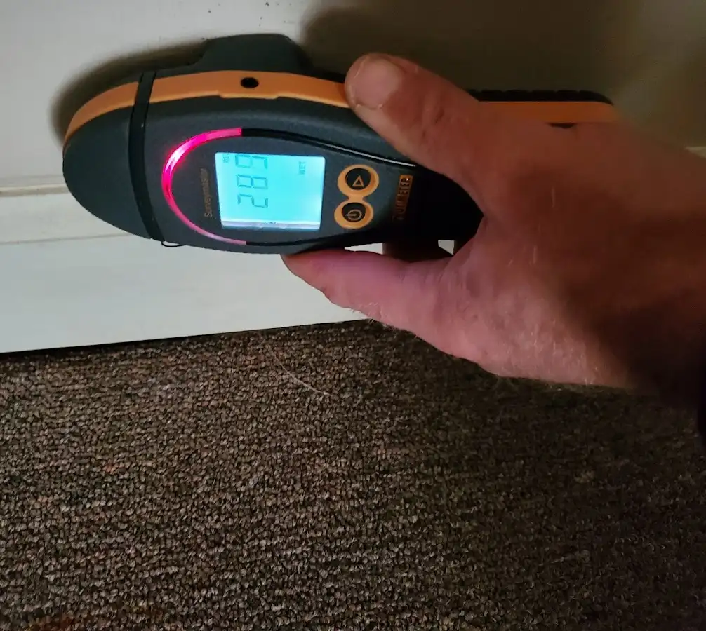 Moisture detection at baseboard during Storm Damage Restoration in Ashtabula